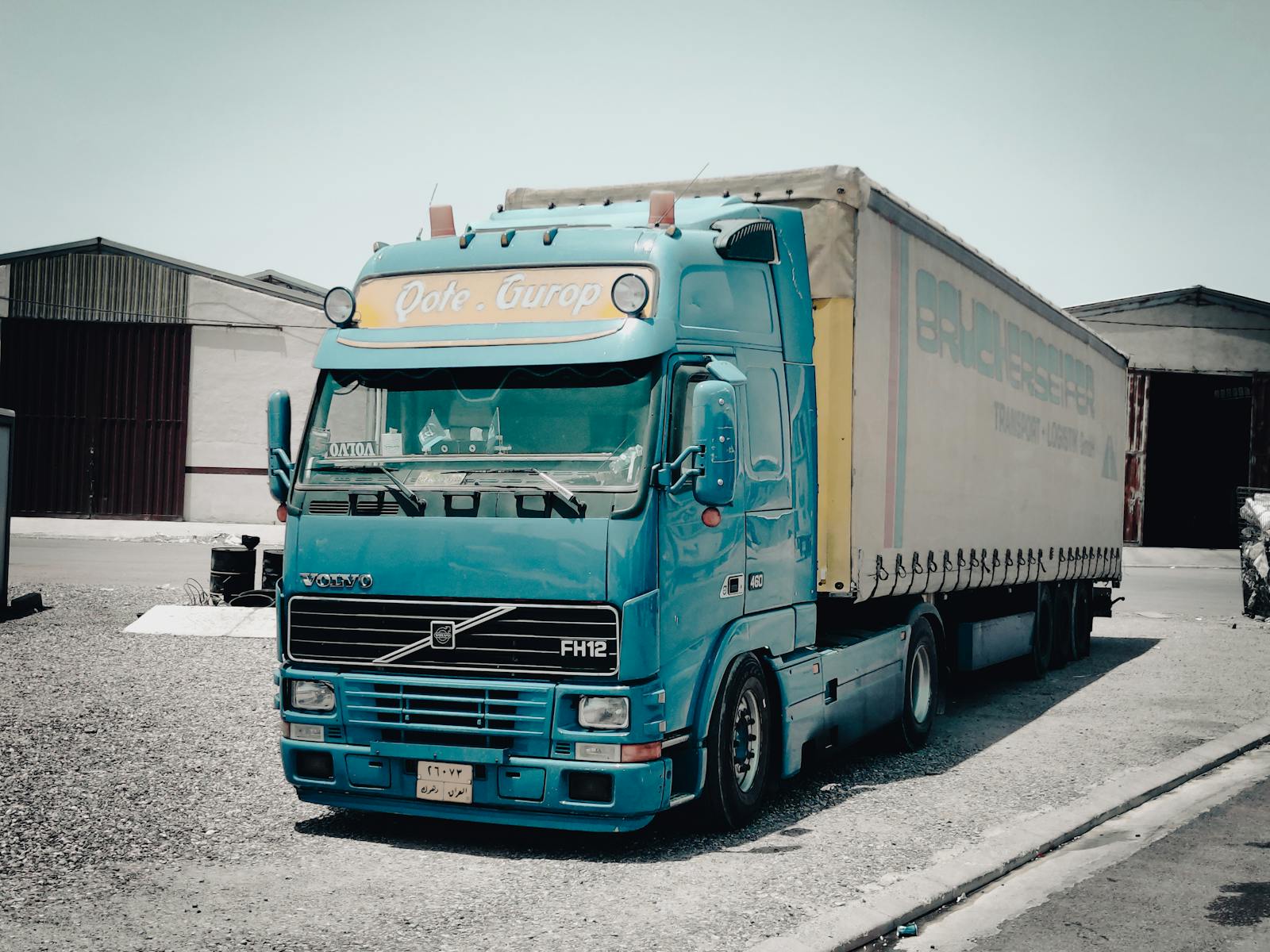 Blue Volvo heavy-duty truck inside a warehouse facility