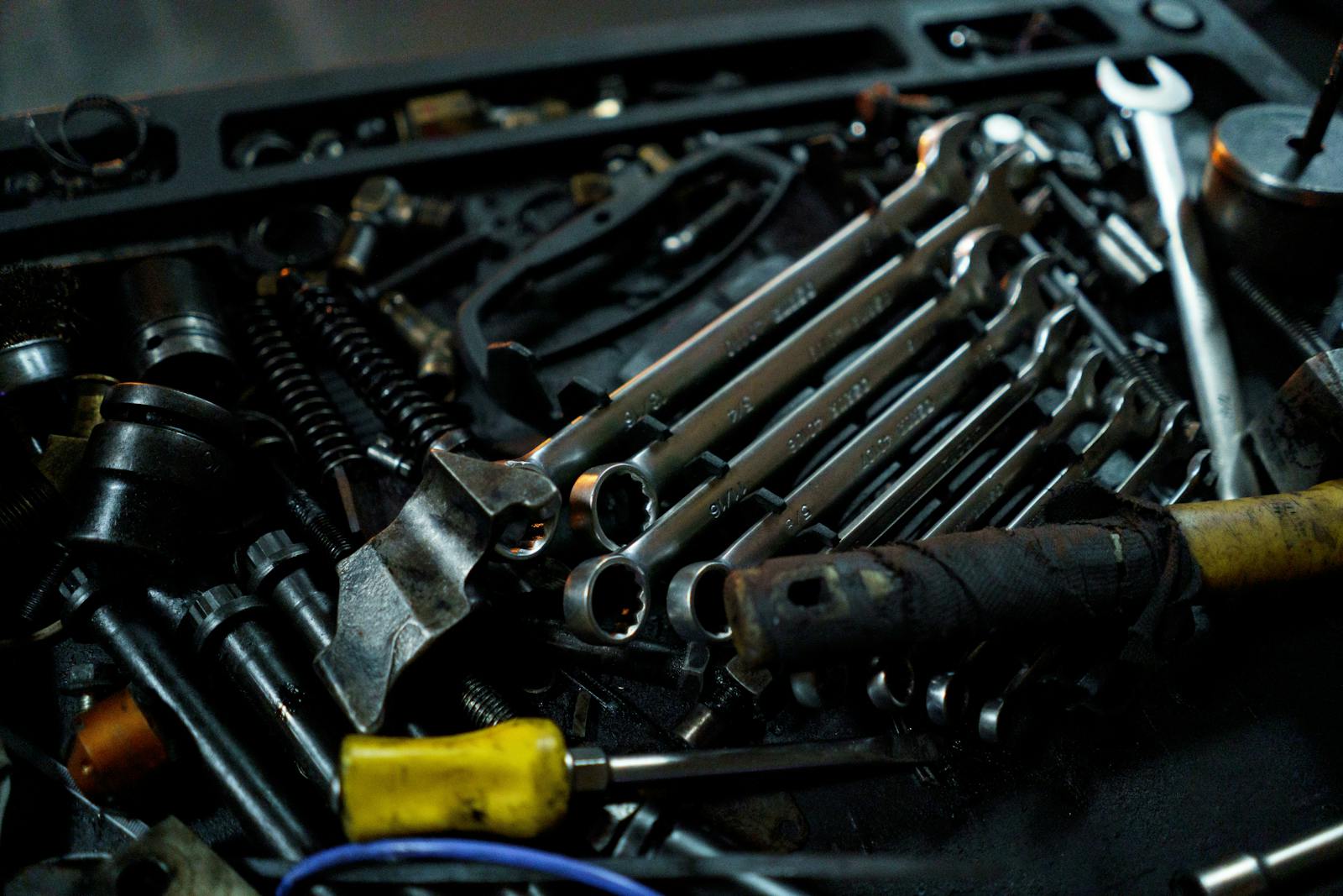 Mechanical tools and wrenches inside a working toolbox
